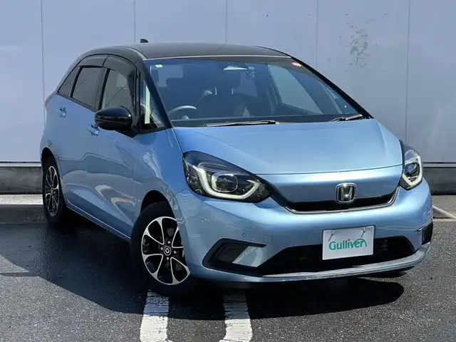 ホンダ フィット ホーム 三重県 2020(令2)年 1.9万km ライトブルー 2トーンカラー（ブラックルーフ/ブラックミラー）/8インチナビ(KENWOOD:彩速ナビ)（Bluetooth/CD/DVD/地デジTV/AM/FM/HDMI/iPod/USB/SD）/ETC/バックカメラ/ドライブレコーダー/ホンダセンシング（衝突軽減ブレーキ/誤発進抑制機能/後方誤発進抑制機能/近距離衝突軽減ブレーキ/歩行者事故低減ステアリング/路外逸脱抑制機能/アダプティブクルーズコントロール/車線維持支援システム/先行車発進お知らせ機能/標識認識機能/オートハイビーム）/LEDヘッドランプ/ハーフシェイドフロントウインドウ/液晶メーター/マルチインフォメーションディスプレイ/オートエアコン/リアヒーターダクト/ハーフレザーシート/社外15インチアルミホイール(スマート純正)/スペアキー