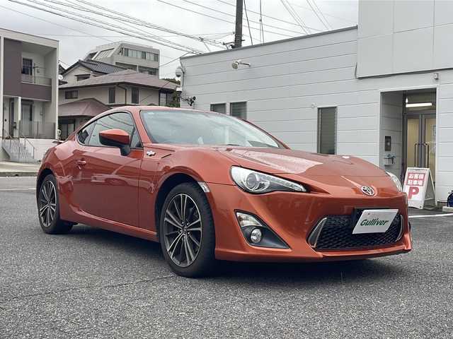 トヨタ ８６ GT リミテッド 愛知県 2013(平25)年 10.6万km オレンジメタリック HDDナビ（NHZD-W62G）/・Bluetooth/・フルセグTV/・AM/FM/・CD/DVD/社外セキュリティ/ETC/ドライブレコーダー前方（TZ-D102）/シートヒーター前席/オートエアコン/バックモニター/純正フロアマット/オートエアコン/パドルシフト/取扱説明書/スマートキー2本