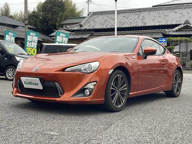 トヨタ ８６ GT リミテッド 愛知県 2013(平25)年 10.6万km オレンジメタリック HDDナビ（NHZD-W62G）/・Bluetooth/・フルセグTV/・AM/FM/・CD/DVD/社外セキュリティ/ETC/ドライブレコーダー前方（TZ-D102）/シートヒーター前席/オートエアコン/バックモニター/純正フロアマット/オートエアコン/パドルシフト/取扱説明書/スマートキー2本