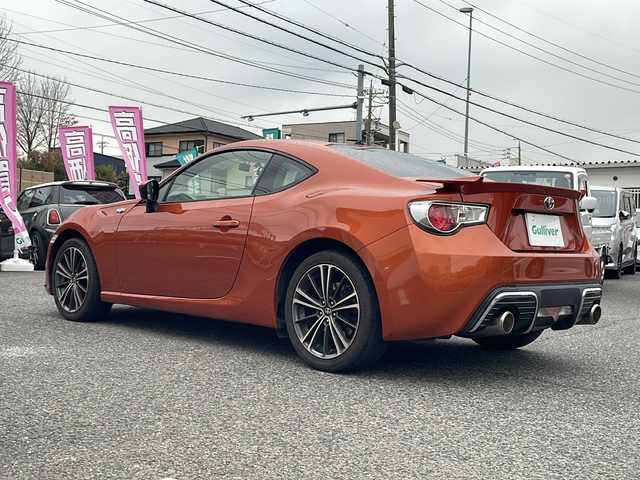 トヨタ ８６ GT リミテッド 愛知県 2013(平25)年 10.6万km オレンジメタリック HDDナビ（NHZD-W62G）/・Bluetooth/・フルセグTV/・AM/FM/・CD/DVD/社外セキュリティ/ETC/ドライブレコーダー前方（TZ-D102）/シートヒーター前席/オートエアコン/バックモニター/純正フロアマット/オートエアコン/パドルシフト/取扱説明書/スマートキー2本