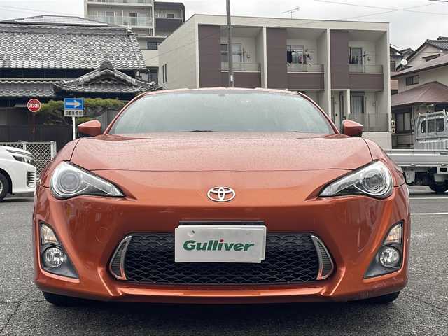 トヨタ ８６ GT リミテッド 愛知県 2013(平25)年 10.6万km オレンジメタリック HDDナビ（NHZD-W62G）/・Bluetooth/・フルセグTV/・AM/FM/・CD/DVD/社外セキュリティ/ETC/ドライブレコーダー前方（TZ-D102）/シートヒーター前席/オートエアコン/バックモニター/純正フロアマット/オートエアコン/パドルシフト/取扱説明書/スマートキー2本