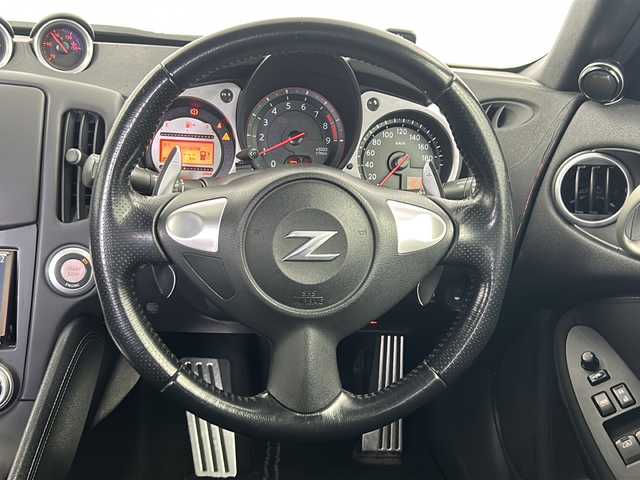 日産 フェアレディ Ｚ 鹿児島県 2009(平21)年 12.2万km タイタニウムグレー 社外ナビ/（フルセグ/CD/DVD）/純正エアロ（フロント/リア/リアスポイラー）/パドルシフト/コーナーセンサー/オートライト/RECOROシート/デジタルインナーミラー/ビルドインETC/オートライト/ケンウッド製サブスピーカー/プッシュスタートボタン/純正アルミホイール