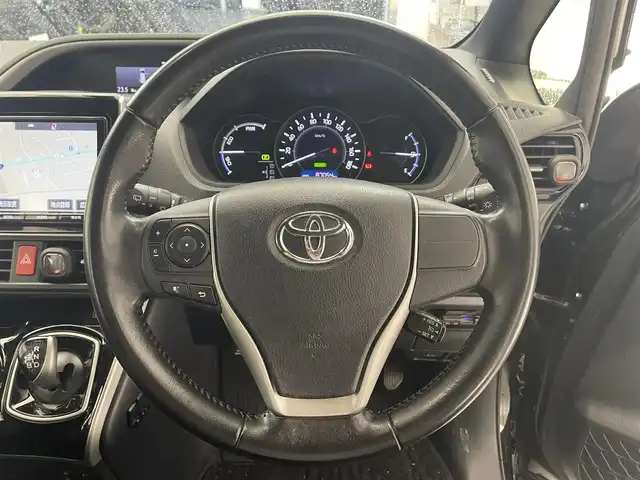 トヨタ ヴォクシー ハイブリッド ZS 煌 滋賀県 2018(平30)年 8.7万km イナズマスパーキングブラックガラスフレーク 純正9インチナビ/Bluetooth/CD/DVD/フルセグTV/フリップダウンモニター/クルーズコントロール/バックカメラ/両側電動スライドドア/シートヒーター/ステアリングリモコン/LEDヘッドライト/ドライブレコーダー/ETC