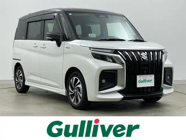 スズキ ソリオ バンディット HV MV 岡山県 2025(令7)年 0.3万km ピュアホワイトパール/ガンメタリック2トーン ワンオーナー　/純正9型ディスプレイオーディオ　/　「ナビ/BT/フルセグ/CD/DVD/Carplay」/全方位カメラ　/ブラインドスポットモニター/両側パワースライドドア/前席シートヒーター/レーダークルーズコントロール　/オートハイビーム/ＬＥＤヘッドライト　/ドライブレコーダー/衝突被害軽減システム/ヘッドアップディスプレイ/オートブレーキホールド/プッシュスタート/スマートキー×２/保証書/取扱説明書/ナビ取扱説明書