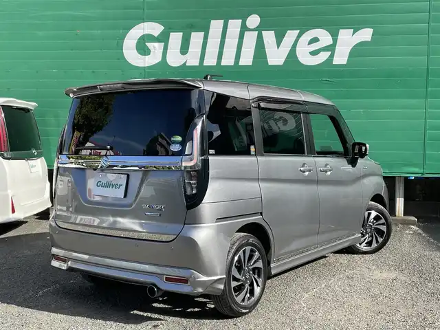 スズキ ソリオ バンディット HV MV 東京都 2021(令3)年 2.5万km プレミアムシルバーメタリック ワンオーナー/純正9インチメモリナビ/(フルセグ/DVD/CD/スマートフォン連携機能)/アラウンドビューモニター/セーフティーサポート/・アダプティブクルーズコントロール/・デュアルカメラブレーキサポート/・車線逸脱警報機能/・前後方誤発進抑制機能/・後退時ブレーキサポート/・リアパーキングセンサー/ヘッドアップディスプレイ/両側パワースライドドア/LEDライト/純正フロアマット/ロールサンシェード/前後ドライブレコーダー(DRV-MR450)/ETC/取扱説明書/保証書/スペアキー×1