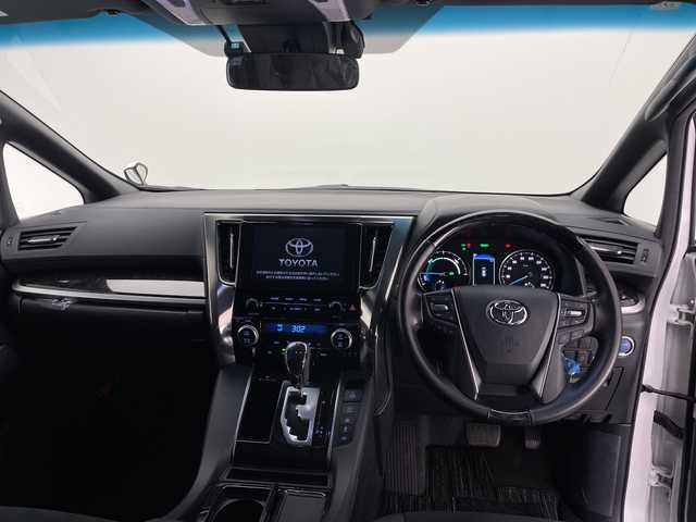 トヨタ アルファードハイブリット S タイプゴールド 長野県 2020(令2)年 2.7万km ホワイトパールクリスタルシャイン 4WD/純正メモリナビ&フルセグTV&USB&BT/トヨタセーフティセンス/アダプティブクルーズコントロール/レーントレーシングアシスト/プリクラッシュセーフティ/クリアランスソナー/パーキングサポートブレーキ/オートマチックハイビーム/ロードサインアシスト/純正前方ドライブレコーダー/両側パワースライドドア/パワーバックドア/ハーフレザーシート/ウォークスルー/2列目オットマン/バックカメラ/ビルトインETC/三眼LEDヘッドライト/オートライト/フロントフォグランプ/電動格納ミラー/ウィンカーミラー/電動ホールド/オートホールド/純正17インチAW装着/純正フロアマット/純正ドアバイザー/プッシュスタート/スマートキー/スペアキー1本/取扱説明書