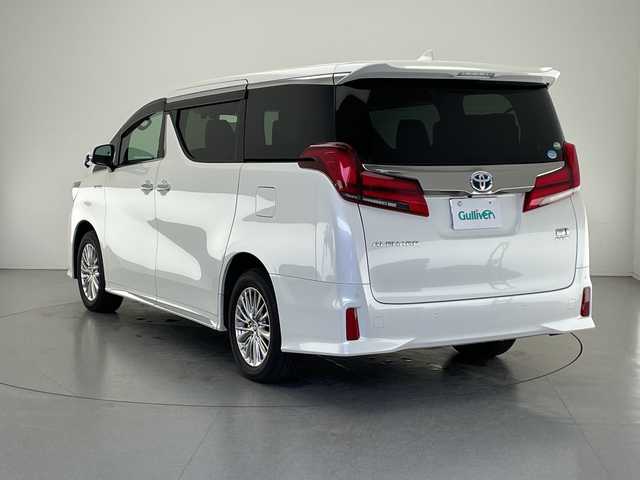 トヨタ アルファードハイブリット S タイプゴールド 長野県 2020(令2)年 2.7万km ホワイトパールクリスタルシャイン 4WD/純正メモリナビ&フルセグTV&USB&BT/トヨタセーフティセンス/アダプティブクルーズコントロール/レーントレーシングアシスト/プリクラッシュセーフティ/クリアランスソナー/パーキングサポートブレーキ/オートマチックハイビーム/ロードサインアシスト/純正前方ドライブレコーダー/両側パワースライドドア/パワーバックドア/ハーフレザーシート/ウォークスルー/2列目オットマン/バックカメラ/ビルトインETC/三眼LEDヘッドライト/オートライト/フロントフォグランプ/電動格納ミラー/ウィンカーミラー/電動ホールド/オートホールド/純正17インチAW装着/純正フロアマット/純正ドアバイザー/プッシュスタート/スマートキー/スペアキー1本/取扱説明書
