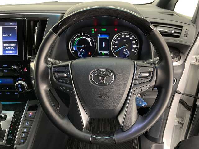 トヨタ アルファードハイブリット S タイプゴールド 長野県 2020(令2)年 2.7万km ホワイトパールクリスタルシャイン 4WD/純正メモリナビ&フルセグTV&USB&BT/トヨタセーフティセンス/アダプティブクルーズコントロール/レーントレーシングアシスト/プリクラッシュセーフティ/クリアランスソナー/パーキングサポートブレーキ/オートマチックハイビーム/ロードサインアシスト/純正前方ドライブレコーダー/両側パワースライドドア/パワーバックドア/ハーフレザーシート/ウォークスルー/2列目オットマン/バックカメラ/ビルトインETC/三眼LEDヘッドライト/オートライト/フロントフォグランプ/電動格納ミラー/ウィンカーミラー/電動ホールド/オートホールド/純正17インチAW装着/純正フロアマット/純正ドアバイザー/プッシュスタート/スマートキー/スペアキー1本/取扱説明書