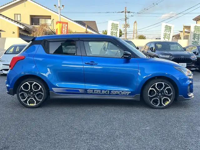 スズキ スイフト スポーツ 大分県 2020(令2)年 10.5万km スピーディーブルーM 〇ワンオーナー/〇純正メモリーナビ（CN-RZ856）/　CD/DVD/BT/フルセグ/〇全方位カメラ/〇社外GReddyリアスポイラー/〇ETC/〇パドルシフト/〇ACC/〇LKA/〇フロアマット/〇ドアバイザー/〇プライバシーガラス/〇革巻きステアリング/〇前後ドライブレコーダー/〇ステアリングスイッチ/〇ウインカーミラー/〇純正LEDヘッドライト/〇純正フォグランプ/〇純正バックフォグ/〇保証書/〇取扱説明書/〇スマートキー/〇エンジンプッシュスタート
