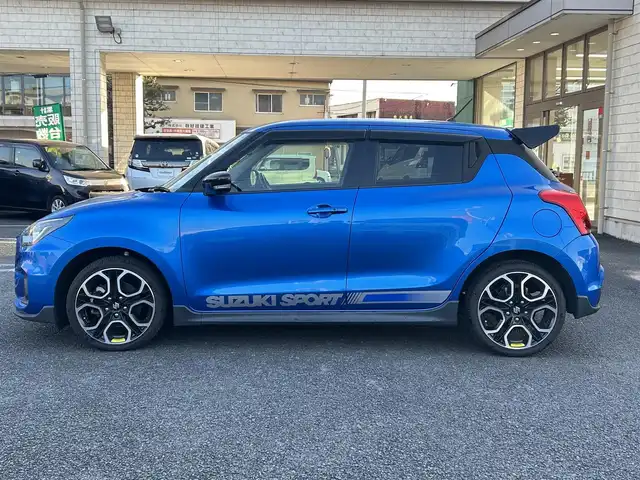 スズキ スイフト スポーツ 大分県 2020(令2)年 10.5万km スピーディーブルーM 〇ワンオーナー/〇純正メモリーナビ（CN-RZ856）/　CD/DVD/BT/フルセグ/〇全方位カメラ/〇社外GReddyリアスポイラー/〇ETC/〇パドルシフト/〇ACC/〇LKA/〇フロアマット/〇ドアバイザー/〇プライバシーガラス/〇革巻きステアリング/〇前後ドライブレコーダー/〇ステアリングスイッチ/〇ウインカーミラー/〇純正LEDヘッドライト/〇純正フォグランプ/〇純正バックフォグ/〇保証書/〇取扱説明書/〇スマートキー/〇エンジンプッシュスタート