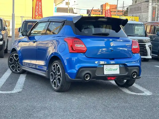 スズキ スイフト スポーツ 大分県 2020(令2)年 10.5万km スピーディーブルーM 〇ワンオーナー/〇純正メモリーナビ（CN-RZ856）/　CD/DVD/BT/フルセグ/〇全方位カメラ/〇社外GReddyリアスポイラー/〇ETC/〇パドルシフト/〇ACC/〇LKA/〇フロアマット/〇ドアバイザー/〇プライバシーガラス/〇革巻きステアリング/〇前後ドライブレコーダー/〇ステアリングスイッチ/〇ウインカーミラー/〇純正LEDヘッドライト/〇純正フォグランプ/〇純正バックフォグ/〇保証書/〇取扱説明書/〇スマートキー/〇エンジンプッシュスタート