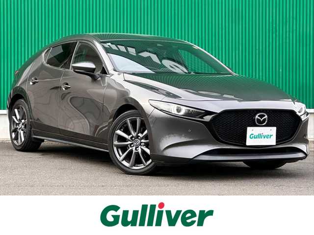 マツダ マツダ３ファストバック XD バーガンディセレクション 宮城県 2021(令3)年 8.5万km マシーングレープレミアムM BOSEサウンドシステム/360度セーフティパッケージ/・360度ビューモニター/・ドライバーモニタリング/＝＝＝/スマートブレーキサポート/AT誤発進抑制制御/全車速追従機能付レーダークルーズコントロール/クルージングトラフィックサポート/車線逸脱警報システム/レーンキープアシスト/前後側方接近車両検知/ブラインドスポットモニタリング/パーキングセンサー（フロント/リア）/ドライバーアテンションアラート/マツダコネクト8.8インチセンターディスプレイ/・CD/DVD/・Bluetooth/・フルセグTV/ヘッドアップディスプレイ/ビルトインETC/ミラー一体型ドライブレコーダー/本革シート/運転席メモリー機能付パワーシート/シートヒーター/ステアリングヒーター/革巻きステアリング/パドルシフト/ステアリングスイッチ/電動パーキングブレーキ/ブレーキホールド/アダプティブLEDヘッドランプ/オートライト/スマートキー＆プッシュスタート/電動格納ミラー/純正18インチAW/純正フロアマット/トノカバー