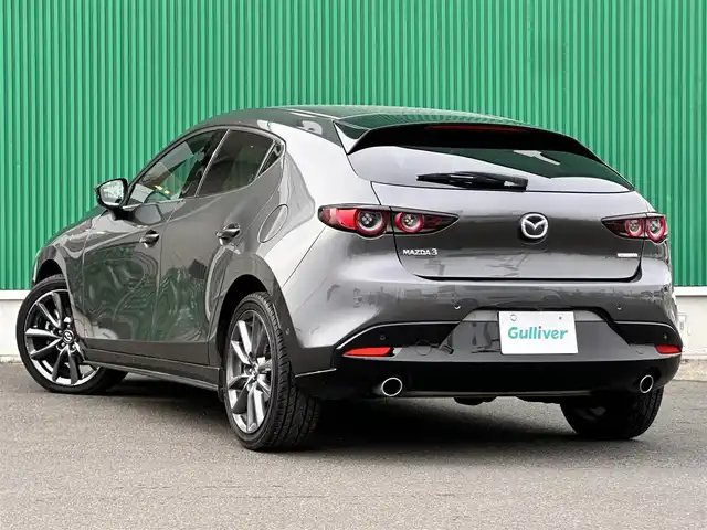 マツダ マツダ３ファストバック XD バーガンディセレクション 宮城県 2021(令3)年 8.5万km マシーングレープレミアムM BOSEサウンドシステム/360度セーフティパッケージ/・360度ビューモニター/・ドライバーモニタリング/＝＝＝/スマートブレーキサポート/AT誤発進抑制制御/全車速追従機能付レーダークルーズコントロール/クルージングトラフィックサポート/車線逸脱警報システム/レーンキープアシスト/前後側方接近車両検知/ブラインドスポットモニタリング/パーキングセンサー（フロント/リア）/ドライバーアテンションアラート/マツダコネクト8.8インチセンターディスプレイ/・CD/DVD/・Bluetooth/・フルセグTV/ヘッドアップディスプレイ/ビルトインETC/ミラー一体型ドライブレコーダー/本革シート/運転席メモリー機能付パワーシート/シートヒーター/ステアリングヒーター/革巻きステアリング/パドルシフト/ステアリングスイッチ/電動パーキングブレーキ/ブレーキホールド/アダプティブLEDヘッドランプ/オートライト/スマートキー＆プッシュスタート/電動格納ミラー/純正18インチAW/純正フロアマット/トノカバー