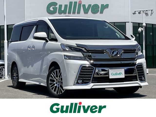 トヨタ ヴェルファイア ZA Gエディション 佐賀県 2017(平29)年 6.2万km ホワイトパールクリスタルシャイン Wサンルーフ/プリクラッシュセーフティシステム/レーダークルーズコントロール/ロードサインアシスト/アダプティブハイビームシステム/インテリジェントクリアランスソナー/誤発進抑制制御機能/純正10インチナビ(NSZN-Z66T)/　フルセグTV　CD　DVD　SD　BT/純正フリップダウンモニター【V12T-R66C】/バックカメラ/前後ドライブレコーダー/ビルトインETC/パワーバックドア/両側パワースライドドア/Ｄ＋Ｎ席パワーシート(D席メモリー機能付)/シートヒーター/電動オットマン/ISOFIX/100V電源/後席用パワーサイドサンシェード/ステアリングヒーター/ステアリングリモコン/純正18インチアルミホイール/純正LEDヘッドライト/オートマチックハイビーム/フォグランプ/純正フロアマット/ウィンカーミラー/ドアバイザ―/プッシュスタート/スペアキー