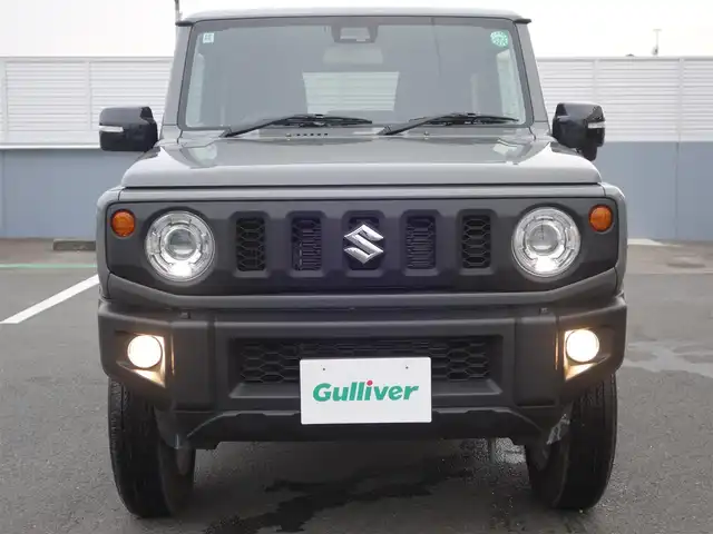 スズキ ジムニー XC 静岡県 2024(令6)年 0.6万km ミディアムグレー ワンオーナー・禁煙車/スズキセーフティーサポート/　デュアルセンサーブレーキ/　誤発進抑制機能/　車線逸脱警報/　ふらつき警報/　先行車発進お知らせ機能/　ハイビームアシスト/クルーズコントロール/LEDヘッドライト/カロッツェリアディスプレイオーディオ/　DVD・CD・BT・USB/ステアリングリモコン対応/バックカメラ/ETC2.0/社外3Dフロアマット/オートアエコン/前席シートヒーター/スマートキー２個