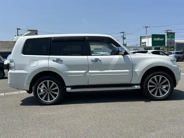三菱 パジェロ ロング エクシード 山形県 2014(平26)年 8.9万km ウォームホワイトパール 4WD/ロックフォードサウンドシステム/後席用ヘッドレストモニター/純正SDナビ/　　【CD DVD BT ワンセグ USB】/バックカメラ/クルーズコントロール/HIDオートヘッドライト/ドライブレコーダー/ステアリングスイッチ/MTモード付AT/電動格納ウィンカーミラー/フォグランプ/WAC/リモコンキー/ETC