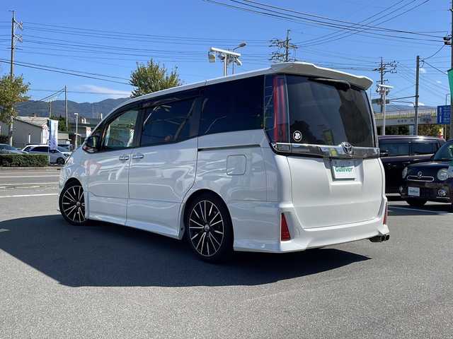 トヨタ ノア Si ダブルバイビー 長野県 2016(平28)年 12.1万km ホワイトパールクリスタルシャイン 車高調/純正10インチナビ/（NSZN-Z66T）/BluetoothAudio/ステアリングスイッチ/フルセグTV/バックカメラ/社外18インチアルミホイール/両側パワースライドドア/オートマチックハイビーム/クルーズコントロール/ハーフレザーシート/純正ビルトインETC/アイドリングストップ/衝突軽減ブレーキ/LEDヘッドライト/ウインカーミラー/スマートキー/オートライト