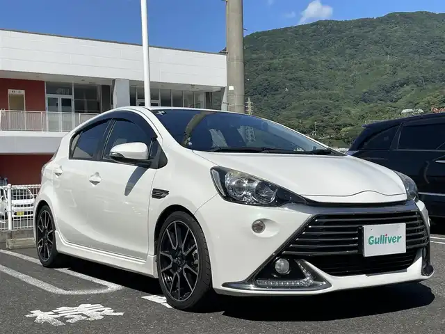 トヨタ アクア G G’s 長崎県 2014(平26)年 13.2万km ライムホワイトパールクリスタルシャイン 純正ディーラーナビ(FM/AM/CD/DVD/BT/TV)/プッシュスタート/ドライビングモードセレクト/バックカメラ/社外ドライブレコーダー/ALPINE製ツイーター/ETC/ハーフレザーシート/G’s純正AW/純正フロアマット/電格ウィンカーミラー/ヘッドライトレベライザ/オートライト/ABS/VSC/スマートキー/USB入力端子/取扱説明書/保証書