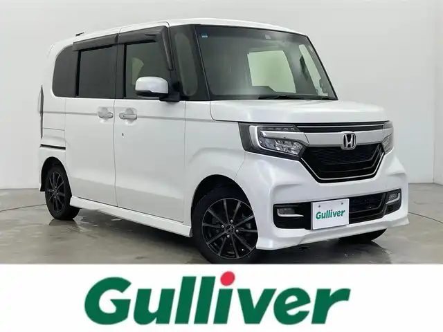 ホンダ Ｎ ＢＯＸ カスタム G L ターボ ホンダセンシング 富山県 2018(平30)年 7.1万km プラチナホワイトパール ターボ/純正ナビ/（AM/FM/BT/TV/Apple Car Play)/フルセグテレビ/バックカメラ/純正フロントドライブレコーダー/レーンキープアシスト/衝突被害軽減システム/カーテンエアバック/レーダークルーズコントロール/オートライト/ウィンカーミラー/ドアバイザー/プッシュスタート/ハーフレザーシート/ベンチシート/両側パワースライドドア/スマートキー×2/ETC