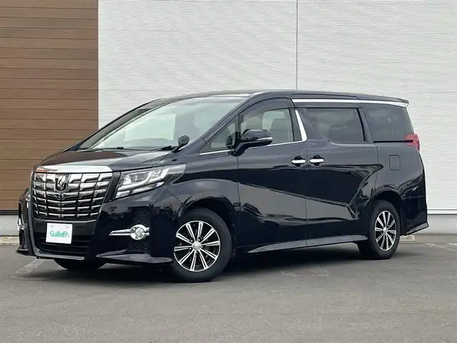 トヨタ アルファード S 秋田県 2015(平27)年 15.5万km スパークリングブラックパールクリスタルシャイン ４WD/両側パワスラ/LEDヘッドライト/社外ナビ/フルセグ/バックカメラ/社外アルミ/スマートキー/アイドリングストップ/コーナーセンサー/パーキングアシスト/プッシュスタート/ステアリングスイッチ/MTモード付AT/フリップダウンモニター/ドライブレコーダー/ETC/純正フロアマット/純正ドアバイザー/寒冷地仕様/オートライト/ダブルオートエアコン/横滑り防止/電動格納ウィンカーミラー