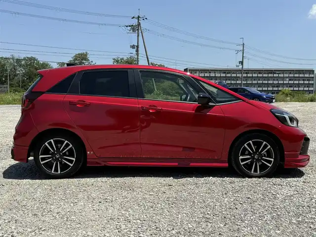 ホンダ フィット e:HEV RS 兵庫県 2023(令5)年 2.6万km プレミアムクリスタルレッドM 無限エアロ(F/S/RU)/純正9インチナビ/バックカメラ/フルセグTV/ビルトインETC/ハーフレザーシート