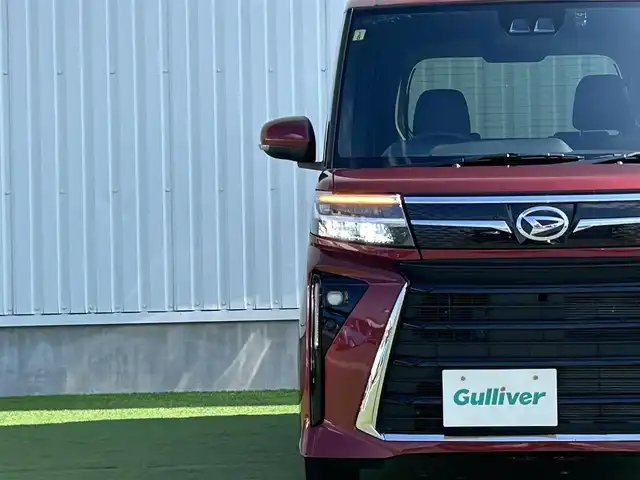 ダイハツ タント カスタム X 香川県 2023(令5)年 0.7万km ファイアークォーツレッドM 登録時走行距離：6138km/スマートアシスト/→衝突回避支援ブレーキ/→車線逸脱警報機能/→先行車発進お知らせ機能/純正7型ナビ/→ＣＤ／ＤＶＤ/→フルセグTV/バックカメラ/両側パワースライドドア/ハーフレザーシート/前席シートヒーター/ステアリングリモコン/LEDヘッドライト/オートライト/ドライブレコーダー/純正14インチアルミホイール/純正フロアマット/スマートキー/プッシュスタート/電動格納ウィンカーミラー/バイザー