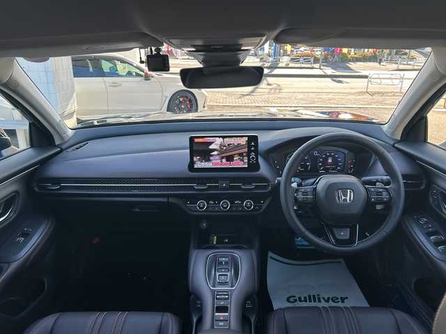 ホンダ ＺＲ－Ｖ ハイブリッド e:HEV Z 東京都 2024(令6)年 0.7万km クリスタルブラックパール ワンオーナー/Honda SENSING/・衝突軽減ブレーキ/・先行車発進お知らせ機能/・歩行者事故低減ステアリング/・路外逸脱抑制機能/・標識認識機能/・渋滞追従機能付アダプティブクルーズコントロール/・車線維持支援システム/・トラフィックジャムアシスト/・ブラインドスポットインフォメーション/・誤発進抑制機能/・後方誤発進抑制機能/・近距離衝突軽減ブレーキ/・パーキングセンサーシステム/・後退出庫サポート（タイプ別設定）/・オートハイビーム/・アダプティブドライビングビーム（タイプ別設定）/レーンアシスト/マルチビューカメラシステム/バックカメラ/Honda CONNECTディスプレー/・Bluetooth/TV/USB/Apple CarPlay/Android Auto/BOSEプレミアムサウンドシステム/盗難防止装置/衝突被害軽減システム/横滑り防止装置/ダウンヒルアシストコントロール/コーナーセンサー/純正18インチアルミホイール/電動リアゲート/パワーシート/シートヒーター/ワイヤレス充電器/ETC/取扱説明書/保証書/スペアキー1本