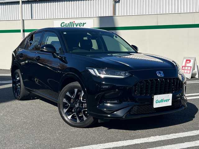 ホンダ ＺＲ－Ｖ ハイブリッド e:HEV Z 東京都 2024(令6)年 0.7万km クリスタルブラックパール ワンオーナー/Honda SENSING/・衝突軽減ブレーキ/・先行車発進お知らせ機能/・歩行者事故低減ステアリング/・路外逸脱抑制機能/・標識認識機能/・渋滞追従機能付アダプティブクルーズコントロール/・車線維持支援システム/・トラフィックジャムアシスト/・ブラインドスポットインフォメーション/・誤発進抑制機能/・後方誤発進抑制機能/・近距離衝突軽減ブレーキ/・パーキングセンサーシステム/・後退出庫サポート（タイプ別設定）/・オートハイビーム/・アダプティブドライビングビーム（タイプ別設定）/レーンアシスト/マルチビューカメラシステム/バックカメラ/Honda CONNECTディスプレー/・Bluetooth/TV/USB/Apple CarPlay/Android Auto/BOSEプレミアムサウンドシステム/盗難防止装置/衝突被害軽減システム/横滑り防止装置/ダウンヒルアシストコントロール/コーナーセンサー/純正18インチアルミホイール/電動リアゲート/パワーシート/シートヒーター/ワイヤレス充電器/ETC/取扱説明書/保証書/スペアキー1本