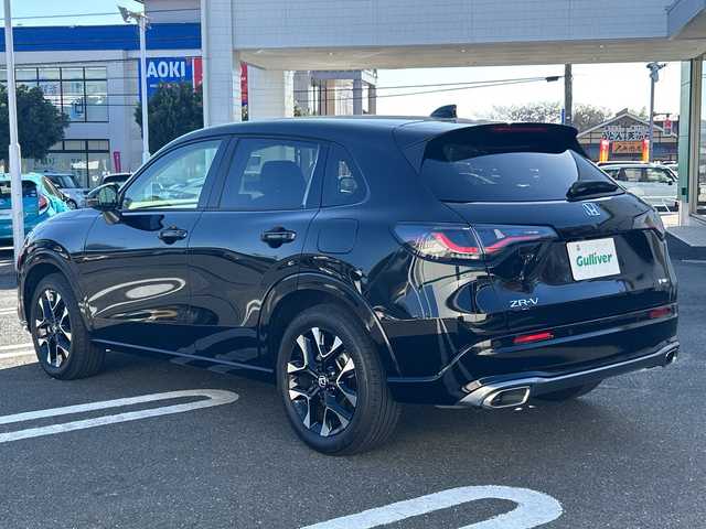 ホンダ ＺＲ－Ｖ ハイブリッド e:HEV Z 東京都 2024(令6)年 0.7万km クリスタルブラックパール ワンオーナー/Honda SENSING/・衝突軽減ブレーキ/・先行車発進お知らせ機能/・歩行者事故低減ステアリング/・路外逸脱抑制機能/・標識認識機能/・渋滞追従機能付アダプティブクルーズコントロール/・車線維持支援システム/・トラフィックジャムアシスト/・ブラインドスポットインフォメーション/・誤発進抑制機能/・後方誤発進抑制機能/・近距離衝突軽減ブレーキ/・パーキングセンサーシステム/・後退出庫サポート（タイプ別設定）/・オートハイビーム/・アダプティブドライビングビーム（タイプ別設定）/レーンアシスト/マルチビューカメラシステム/バックカメラ/Honda CONNECTディスプレー/・Bluetooth/TV/USB/Apple CarPlay/Android Auto/BOSEプレミアムサウンドシステム/盗難防止装置/衝突被害軽減システム/横滑り防止装置/ダウンヒルアシストコントロール/コーナーセンサー/純正18インチアルミホイール/電動リアゲート/パワーシート/シートヒーター/ワイヤレス充電器/ETC/取扱説明書/保証書/スペアキー1本