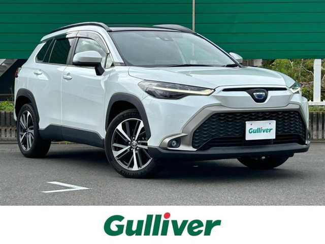 トヨタ カローラ クロス ハイブリッド Z 茨城県 2021(令3)年 2.8万km プラチナホワイトパールマイカ 純正7インチディスプレイオーディオ（AM/FM/Bluetooth接続/フルセグTV/Miracast/USB）/全周囲カメラ/ステアリングヒーター/ブラインドスポットモニター/ウインドシールドデアイサー/サンルーフ/純正2.0ETC/スマートキー/前方ドライブレコーダー/前席パワーシート/前席シートヒーター/クルーズコントロール/100V充電/電動リアゲート/純正フロアマット/オートマチックハイビーム/レーンキープアシスト/コーナーセンサー/衝突被害軽減システム/横滑り防止装置