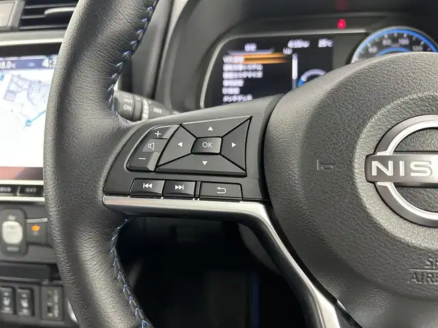 日産 リーフ X Vセレクション 90周年記念車 千葉県 2023(令5)年 0.4万km オーロラフレアブルーパール 禁煙車/プロパイロット/アラウンドビューモニター/インテリジェントルームミラー/車線逸脱防止支援/ふらつき警報/純正9インチナビ/レーダークルーズコントロール/LEDオートライト/ハーフレザーシート/シートヒーター/純正17インチアルミホイール/オートエアコン/USBポート/プッシュスタート/スマートキー