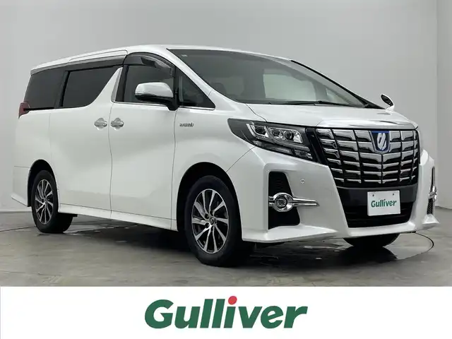 トヨタ アルファードハイブリット SR Cパッケージ 埼玉県 2015(平27)年 9万km ホワイトパールクリスタルシャイン 社外ディスプレイオーディオ　フリップダウンモニター　黒レザー　バックカメラ　ビルトインＥＴＣ　前後ドラレコ　セーフティセンス　レーダークルーズ　メモリシート　シートヒーター　ＡＣ１００Ｖ　ＬＥＤライト