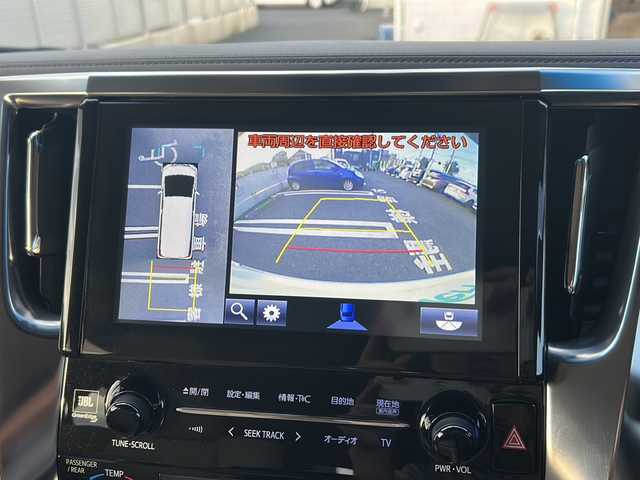 トヨタ アルファードハイブリット G Fパッケージ 東京都 2015(平27)年 7万km ホワイトパールクリスタルシャイン 純正メモリナビ/　CD/DVD/BT/フルセグテレビ/バックカメラ/全方位カメラ/フリップダウンモニター/ウィンカーミラー/オットマン/キャプテンシート/クルーズコントロール/ドアバイザー/プッシュスタート/両側パワースライドドア/パワーバックドア/ビルトインETC/LEDヘッドライト/レザーシート/D/Nシートヒーター/パワーシート/置くだけ充電/前後コーナーセンサー/JBLサウンド/モデリスタエアロ/ハンドルヒーター
