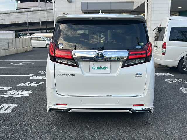 トヨタ アルファードハイブリット G Fパッケージ 東京都 2015(平27)年 7万km ホワイトパールクリスタルシャイン 純正メモリナビ/　CD/DVD/BT/フルセグテレビ/バックカメラ/全方位カメラ/フリップダウンモニター/ウィンカーミラー/オットマン/キャプテンシート/クルーズコントロール/ドアバイザー/プッシュスタート/両側パワースライドドア/パワーバックドア/ビルトインETC/LEDヘッドライト/レザーシート/D/Nシートヒーター/パワーシート/置くだけ充電/前後コーナーセンサー/JBLサウンド/モデリスタエアロ/ハンドルヒーター