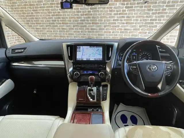 トヨタ アルファードハイブリット G Fパッケージ 岩手県 2015(平27)年 7万km ホワイトパールクリスタルシャイン 純正メモリナビ/　CD/DVD/BT/フルセグテレビ/バックカメラ/全方位カメラ/フリップダウンモニター/ウィンカーミラー/オットマン/キャプテンシート/クルーズコントロール/ドアバイザー/プッシュスタート/両側パワースライドドア/パワーバックドア/ビルトインETC/LEDヘッドライト/レザーシート/D/Nシートヒーター/パワーシート/置くだけ充電/前後コーナーセンサー/JBLサウンド/モデリスタエアロ/ハンドルヒーター