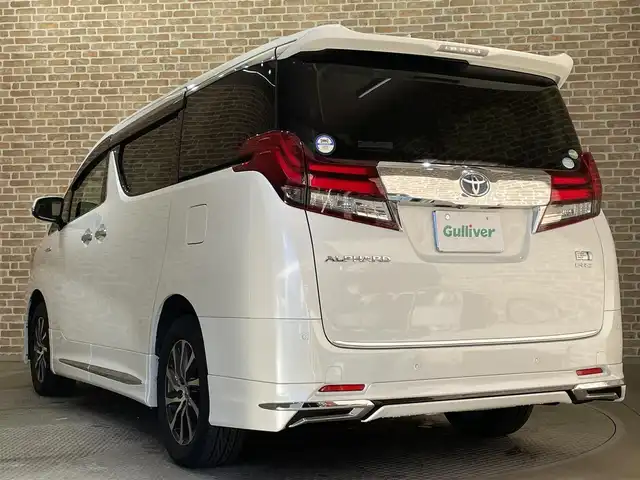 トヨタ アルファードハイブリット G Fパッケージ 岩手県 2015(平27)年 7万km ホワイトパールクリスタルシャイン 純正メモリナビ/　CD/DVD/BT/フルセグテレビ/バックカメラ/全方位カメラ/フリップダウンモニター/ウィンカーミラー/オットマン/キャプテンシート/クルーズコントロール/ドアバイザー/プッシュスタート/両側パワースライドドア/パワーバックドア/ビルトインETC/LEDヘッドライト/レザーシート/D/Nシートヒーター/パワーシート/置くだけ充電/前後コーナーセンサー/JBLサウンド/モデリスタエアロ/ハンドルヒーター