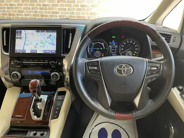 トヨタ アルファードハイブリット G Fパッケージ 岩手県 2015(平27)年 7万km ホワイトパールクリスタルシャイン 純正メモリナビ/　CD/DVD/BT/フルセグテレビ/バックカメラ/全方位カメラ/フリップダウンモニター/ウィンカーミラー/オットマン/キャプテンシート/クルーズコントロール/ドアバイザー/プッシュスタート/両側パワースライドドア/パワーバックドア/ビルトインETC/LEDヘッドライト/レザーシート/D/Nシートヒーター/パワーシート/置くだけ充電/前後コーナーセンサー/JBLサウンド/モデリスタエアロ/ハンドルヒーター
