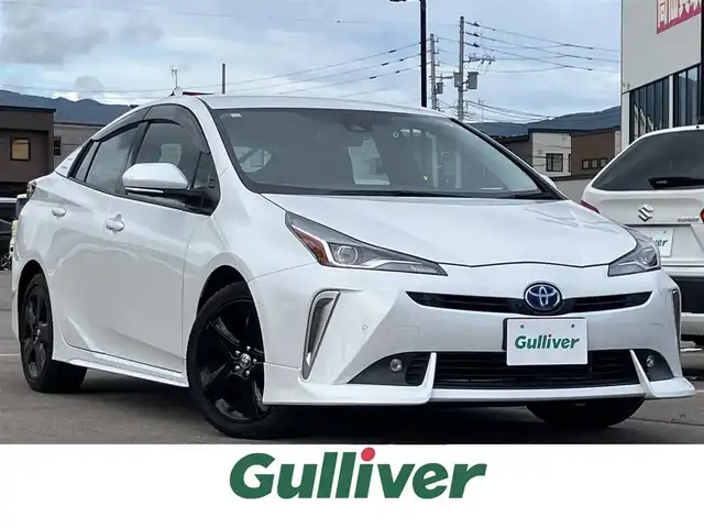 トヨタ プリウス A プレミアム　ツーリングセレ 道南・函館 2021(令3)年 5.4万km プラチナホワイトパールマイカ 純正ナビ（AM/FM/BT）/フルセグTV/全方位カメラ/パーキングアシスト/レザーシート/D席パワーシート　/前席ベンチレーション・シートヒーター/AC100V電源/前後ドラレコ/衝突軽減/コーナーセンサー/BSM/ヘットライトディスプレイ/ETC2.0/ドアバイザー/LEDヘットライト/ディーラー記録（R4.R5.R6.R7）/取説・保証書・記録簿/スペアキー/純正17インチアルミ/純正エアロ（フロント・リア）