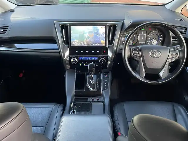 トヨタ ヴェルファイア ハイブリット ZR Gエディション 長野県 2018(平30)年 5.6万km ブラック 純正ナビ（FM、AM、CD、DVD、BT）/フルセグテレビ/バックカメラ/ETC２．０/純正フリップダウンモニター/クルーズコントロール追従有/メモリシート/全席パワーシート/前方ドライブレコーダー/ステアリングヒーター/電動リアゲート/前後コーナーセンサー/衝突軽減システム/純正フルエアロ/横滑り防止装置/両側パワースライドドア/オットマン/１００V充電/純正フロアマット/純正１７AW/LEDオートライト/オートマチックハイビーム/ダブルサイドエアバック/カーテンエアバック/保証書、取扱説明書/スペアキー（１本）