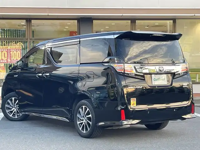 トヨタ ヴェルファイア ハイブリット ZR Gエディション 長野県 2018(平30)年 5.6万km ブラック 純正ナビ（FM、AM、CD、DVD、BT）/フルセグテレビ/バックカメラ/ETC２．０/純正フリップダウンモニター/クルーズコントロール追従有/メモリシート/全席パワーシート/前方ドライブレコーダー/ステアリングヒーター/電動リアゲート/前後コーナーセンサー/衝突軽減システム/純正フルエアロ/横滑り防止装置/両側パワースライドドア/オットマン/１００V充電/純正フロアマット/純正１７AW/LEDオートライト/オートマチックハイビーム/ダブルサイドエアバック/カーテンエアバック/保証書、取扱説明書/スペアキー（１本）