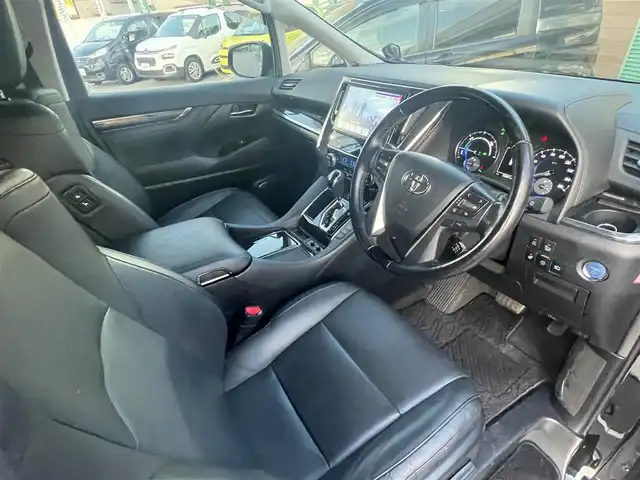 トヨタ ヴェルファイア ハイブリット ZR Gエディション 長野県 2018(平30)年 5.6万km ブラック 純正ナビ（FM、AM、CD、DVD、BT）/フルセグテレビ/バックカメラ/ETC２．０/純正フリップダウンモニター/クルーズコントロール追従有/メモリシート/全席パワーシート/前方ドライブレコーダー/ステアリングヒーター/電動リアゲート/前後コーナーセンサー/衝突軽減システム/純正フルエアロ/横滑り防止装置/両側パワースライドドア/オットマン/１００V充電/純正フロアマット/純正１７AW/LEDオートライト/オートマチックハイビーム/ダブルサイドエアバック/カーテンエアバック/保証書、取扱説明書/スペアキー（１本）