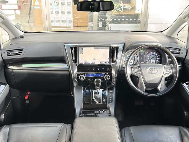 トヨタ ヴェルファイア ハイブリット ZR Gエディション 岩手県 2018(平30)年 5.6万km ブラック 純正ナビ（FM、AM、CD、DVD、BT）/フルセグテレビ/バックカメラ/ETC２．０/純正フリップダウンモニター/クルーズコントロール追従有/メモリシート/全席パワーシート/前方ドライブレコーダー/ステアリングヒーター/電動リアゲート/前後コーナーセンサー/衝突軽減システム/純正フルエアロ/横滑り防止装置/両側パワースライドドア/オットマン/１００V充電/純正フロアマット/純正１７AW/LEDオートライト/オートマチックハイビーム/ダブルサイドエアバック/カーテンエアバック/保証書、取扱説明書/スペアキー（１本）