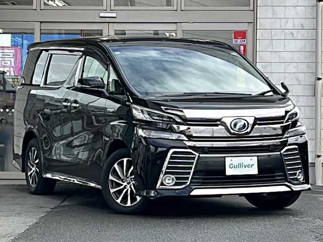 トヨタ ヴェルファイア ハイブリット ZR Gエディション 岩手県 2018(平30)年 5.6万km ブラック 純正ナビ（FM、AM、CD、DVD、BT）/フルセグテレビ/バックカメラ/ETC２．０/純正フリップダウンモニター/クルーズコントロール追従有/メモリシート/全席パワーシート/前方ドライブレコーダー/ステアリングヒーター/電動リアゲート/前後コーナーセンサー/衝突軽減システム/純正フルエアロ/横滑り防止装置/両側パワースライドドア/オットマン/１００V充電/純正フロアマット/純正１７AW/LEDオートライト/オートマチックハイビーム/ダブルサイドエアバック/カーテンエアバック/保証書、取扱説明書/スペアキー（１本）