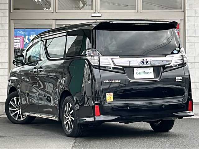 トヨタ ヴェルファイア ハイブリット ZR Gエディション 岩手県 2018(平30)年 5.6万km ブラック 純正ナビ（FM、AM、CD、DVD、BT）/フルセグテレビ/バックカメラ/ETC２．０/純正フリップダウンモニター/クルーズコントロール追従有/メモリシート/全席パワーシート/前方ドライブレコーダー/ステアリングヒーター/電動リアゲート/前後コーナーセンサー/衝突軽減システム/純正フルエアロ/横滑り防止装置/両側パワースライドドア/オットマン/１００V充電/純正フロアマット/純正１７AW/LEDオートライト/オートマチックハイビーム/ダブルサイドエアバック/カーテンエアバック/保証書、取扱説明書/スペアキー（１本）
