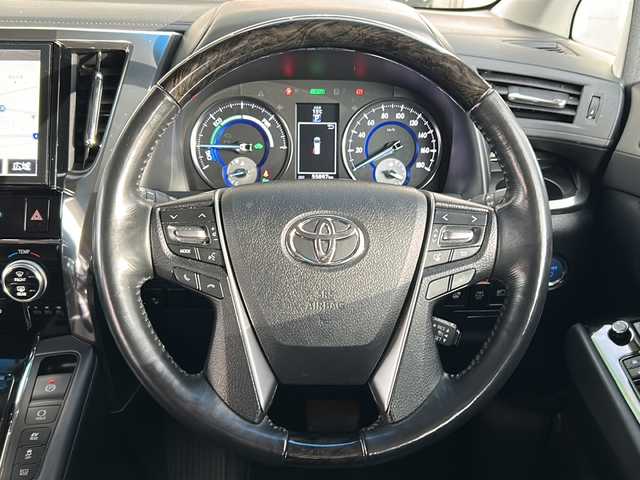 トヨタ ヴェルファイア ハイブリット ZR Gエディション 岩手県 2018(平30)年 5.6万km ブラック 純正ナビ（FM、AM、CD、DVD、BT）/フルセグテレビ/バックカメラ/ETC２．０/純正フリップダウンモニター/クルーズコントロール追従有/メモリシート/全席パワーシート/前方ドライブレコーダー/ステアリングヒーター/電動リアゲート/前後コーナーセンサー/衝突軽減システム/純正フルエアロ/横滑り防止装置/両側パワースライドドア/オットマン/１００V充電/純正フロアマット/純正１７AW/LEDオートライト/オートマチックハイビーム/ダブルサイドエアバック/カーテンエアバック/保証書、取扱説明書/スペアキー（１本）