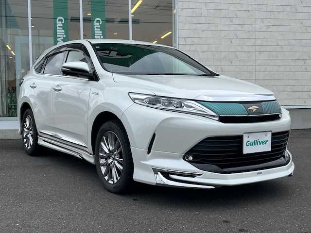 トヨタ ハリアー ハイブリッド プレミアム 岩手県 2018(平30)年 9.4万km ホワイトパールクリスタルシャイン 4WD/純正ナビ(CD/DVD/ラジオ/SD/AUX/USB/BT)/JBLプレミアムサウンド/フルセグテレビ/バックカメラ/モデリスタエアロ(F・S・R)/プリクラッシュセーフティ/レーンディパーチャーアラート/レーダークルーズコントロール/オートハイビーム/シーケンシャルウィンカー/パワーバックドア/ハーフレザーシート/ビルトインETC/前方ドライブレコーダー/横滑り防止機能/LEDヘッドライト/フォグランプ/純正18inアルミホイール/純正フロアマット/ドアバイザー/取説＆保証書