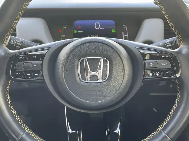 ホンダ フィット e:HEV RS 兵庫県 2022(令4)年 1.1万km プラチナホワイトパール ・ワンオーナー/・無限エアロ//フロントアンダー/サイド/リヤアンダースポイラー/・無限フロントグリルガーニッシュ/・無限カーボンテールゲートガーニッシュ/・無限17インチAW/・HONDA CONNECTナビ/・地デジ/BT/USB/Apple Car Play/Android Auto/・バックカメラ/・ステアリングリモコン/・パドルシフト/・ビルトインETC/・デイタイムランニングライト/・ドライブレコーダー（前方）/・アダプティブクルーズコントロール/・CMBS警告/・先行車発進お知らせ/・路外逸脱抑制制御/・レーンキープアシストシステム/・標識認識機能/・リヤパーキングセンサー/・コーナーセンサー/・オートハイビーム/・R5/6ディーラー点検記録簿