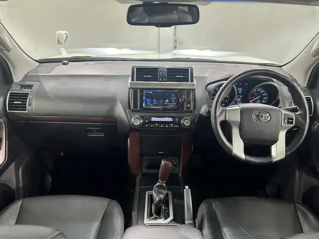 トヨタ ランドクルーザー プラド TX Lパッケージ 愛知県 2014(平26)年 6.5万km ホワイトパールクリスタルシャイン ＳＤナビ　/(Ｂｌｕｅｔｏｏｔｈ/フルセグＴＶ/SD/CD・DVD再生/iPod)/サンルーフ　/黒レザーシート　/前席シートヒーター　/ＥＴＣ　/バックカメラ　/USB接続/電動パワーシート　/クルーズコントロール　/ＬＥＤヘッドライト　　/純正フロアマット　/ＬＥＤフォグ/盗難防止装置