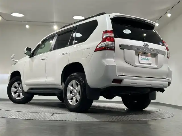 トヨタ ランドクルーザー プラド TX Lパッケージ 愛知県 2014(平26)年 6.5万km ホワイトパールクリスタルシャイン ＳＤナビ　/(Ｂｌｕｅｔｏｏｔｈ/フルセグＴＶ/SD/CD・DVD再生/iPod)/サンルーフ　/黒レザーシート　/前席シートヒーター　/ＥＴＣ　/バックカメラ　/USB接続/電動パワーシート　/クルーズコントロール　/ＬＥＤヘッドライト　　/純正フロアマット　/ＬＥＤフォグ/盗難防止装置