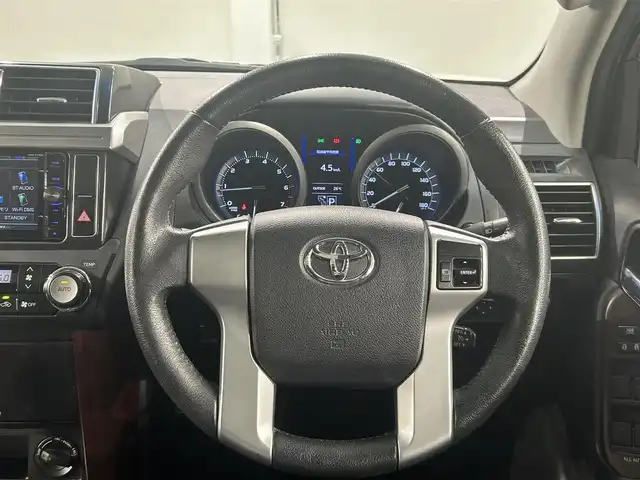 トヨタ ランドクルーザー プラド TX Lパッケージ 愛知県 2014(平26)年 6.5万km ホワイトパールクリスタルシャイン ＳＤナビ　/(Ｂｌｕｅｔｏｏｔｈ/フルセグＴＶ/SD/CD・DVD再生/iPod)/サンルーフ　/黒レザーシート　/前席シートヒーター　/ＥＴＣ　/バックカメラ　/USB接続/電動パワーシート　/クルーズコントロール　/ＬＥＤヘッドライト　　/純正フロアマット　/ＬＥＤフォグ/盗難防止装置